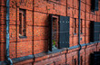 red brick wall with old window