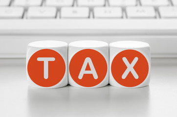 Wall Mural - letter dice in front of a keyboard - tax