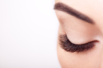 Wall Mural - female eye with extreme long false eyelashes. eyelash extensions. makeup, cosmetics, beauty. close u