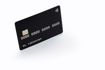 Wall Mural - Black credit card on white background with natural shadow