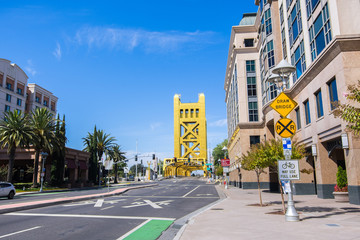 Urban landscape in downtown Sacramento; the Tower Bridge visible in the background; California