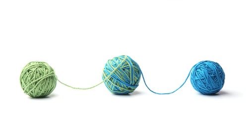 Wall Mural - colorful cotton thread balls from two color green and blue thread isolated on white background. diff