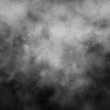 Isolated white fog on the black background, smoky effect for photos and artworks. Overlay for photos.