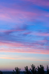 landscape with dramatic light - beautiful golden sunset with saturated sky and clouds.