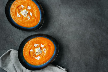 Wall Mural - Top view of pumpkin soup in two plates