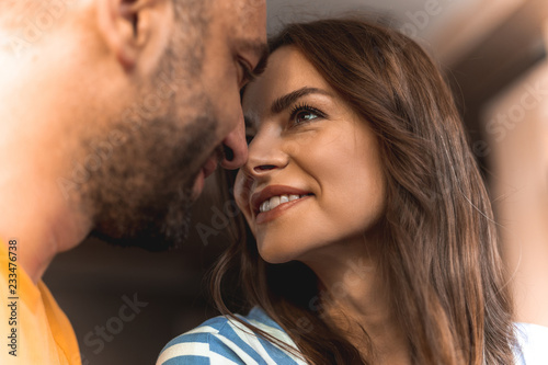Fotografie, Obraz Close up of beautiful happy couple in love looking to each other very tenderly w