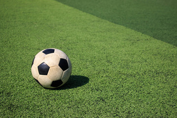 Football on artificial turf. It is for green background in a stadium