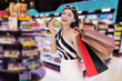 © geargodz - woman holding credit card and shopping bag at mall