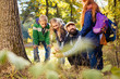 © zinkevych - Mushroom search. Cheerful positive man looking at his pupil while finding a mushroom