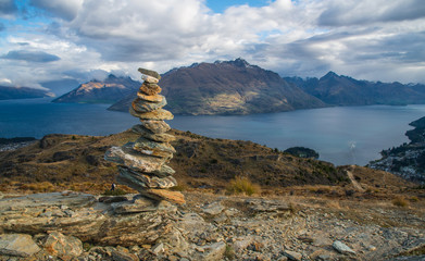 Wall Mural - Spectacular landscape and stone stacking on the summit of Queenstown hill in South Island of New Zealand.