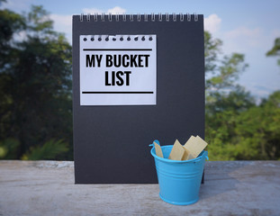 Wall Mural - Inspirational and conceptual - ‘My bucket list ‘ written on a white sticky note. With vintage styled background.