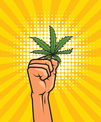 Wall Mural - Fist held high hold on cannabis leaf.