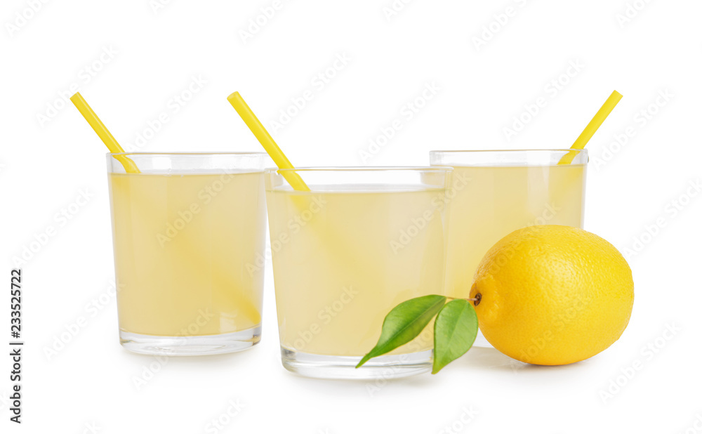Glasses of cool tasty lemonade on white background
