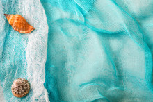 Seashells And Starfish On Cian Cloth Background