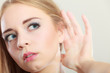 © anetlanda - Woman with hand behind ear spying