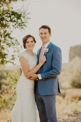 Wall Mural - Beautiful Couple on their Wedding day in front of landscape