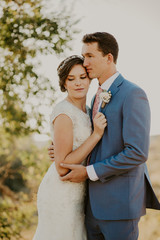 Wall Mural - Beautiful Couple on their Wedding day in front of landscape