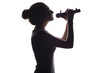 silhouette of girl with singing into microphone, profile of young woman face performing lyric song on white isolated background