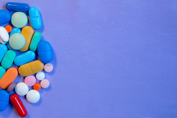 Poster - Colorful pills on neutral blue background