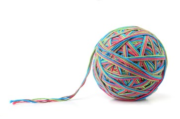 Wall Mural - colorful cotton big thread ball from four color thread isolated on white background. different color