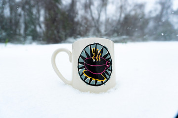 Coffee sitting in the snow