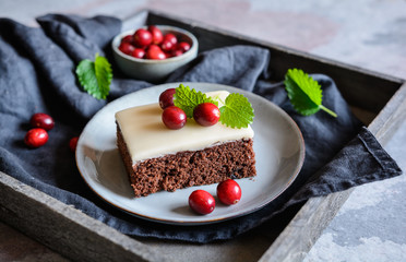 Wall Mural - Cocoa cake with cranberries and marzipan glaze