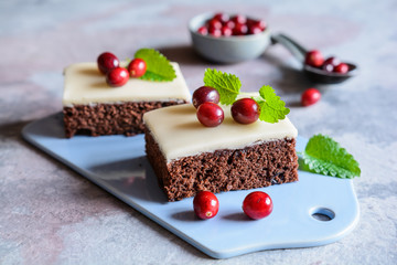 Wall Mural - Cocoa cake with cranberries and marzipan glaze