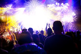 Fototapeta Dmuchawce - crowd watching fireworks - New Year celebrations