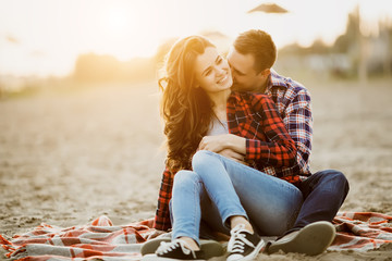 loving couple embracing on the beach