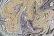 de-Saturated abstract greys and soft colors marble movement textured painted art background