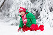 © famveldman - Boy on sleigh ride. Child sledding. Kid with sledge