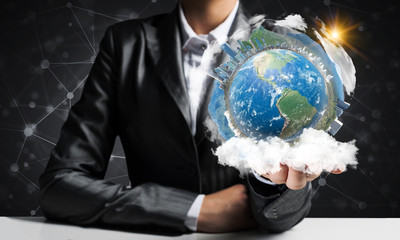 Wall Mural - Businessman presenting Earth globe.