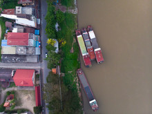 Top View Of Drone Camera Of Laos Transportation Boats Parking At Golden Triangle Port Of Chiang Saen,Chiang Rai,Thailand