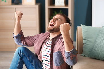 Canvas Print - Happy young man at home