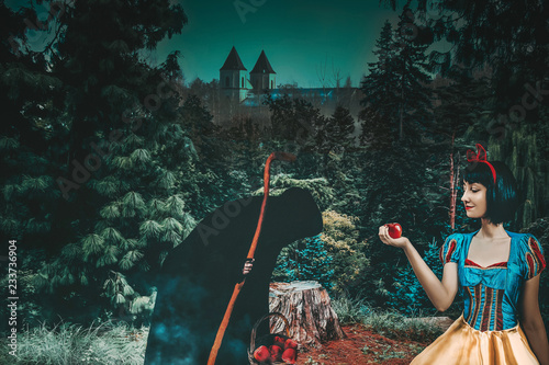 Fotografie, Obraz Snow White girl with old evil witch gives her an apple in the mysterious forest closeup