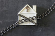  House in chains. Concept  -  risks, lose property,  seize, mortgage.