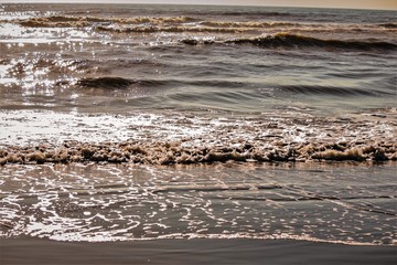 beach sand and waves gliding