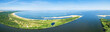 Widefield panoramic aerial view of beach by the blue Baltic sea and Vistula river mouth