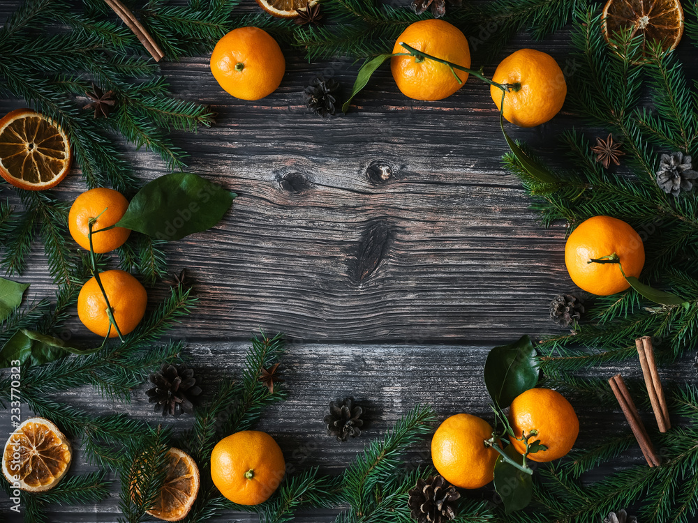 Christmas background with Mandarins, fir branches and pine cones ...