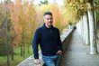© Khorzhevska - Handsome middle-aged man walking autumn park. Urban male portrait, image toned and noise added.