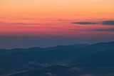 Fototapeta Zachód słońca - Mountain sunset on the Arvo lake, in the heart of the Sila National Park, Calabria, Italy