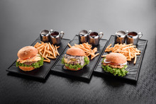 Various Burgers With French Fries Hamburgers On Plate