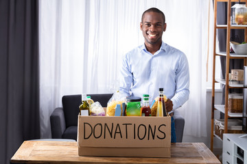 Wall Mural - Smiling Man With Donation Box