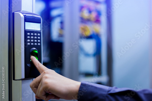 Fotografía Staff push down electronic control machine with finger scan to access the door of control room or data center