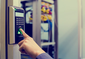 Staff push down electronic control machine with finger scan to access the door of control room or data center.