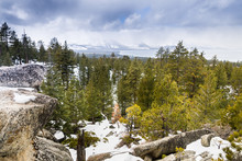 Cloudy Spring Day With Snow Covering The Sierra Mountains, Lake Tahoe In The Background; Van Sickle Bi-State Park; California