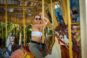 Young woman on carousel