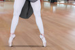 © Creativa Images - Young ballerina feet dancing with tiptoe poses