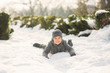 © Aleksandr - A boy in winter clothes jumps into the snow