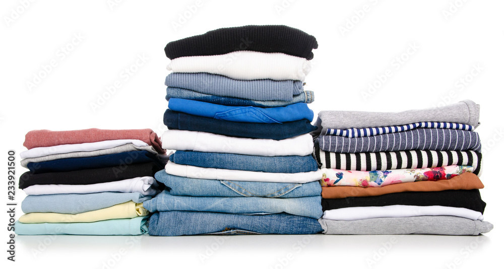 A stack of clothes jeans t-shirt shirt on a white background. Isolation - obrazy, fototapety, plakaty 